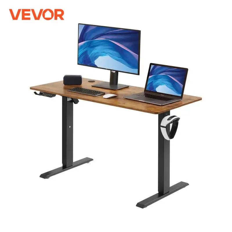 Bureau d’angle électrique en bois avec écran et ordinateur portable posé dessus vue de face, équipé d’un moniteur et d’un